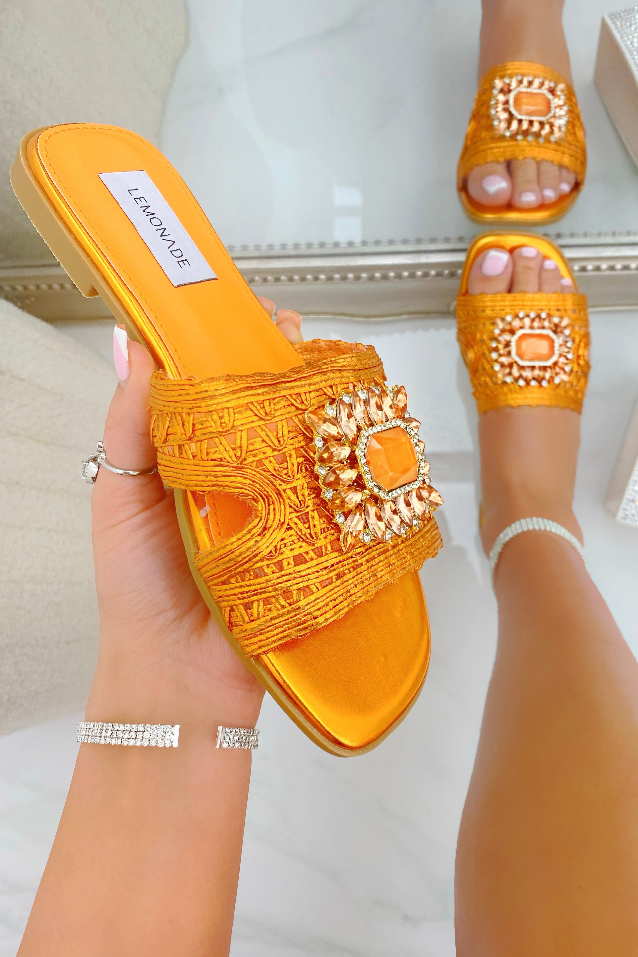 Crystal Bloom Sliders Orange, drawing attention to crystal Motif