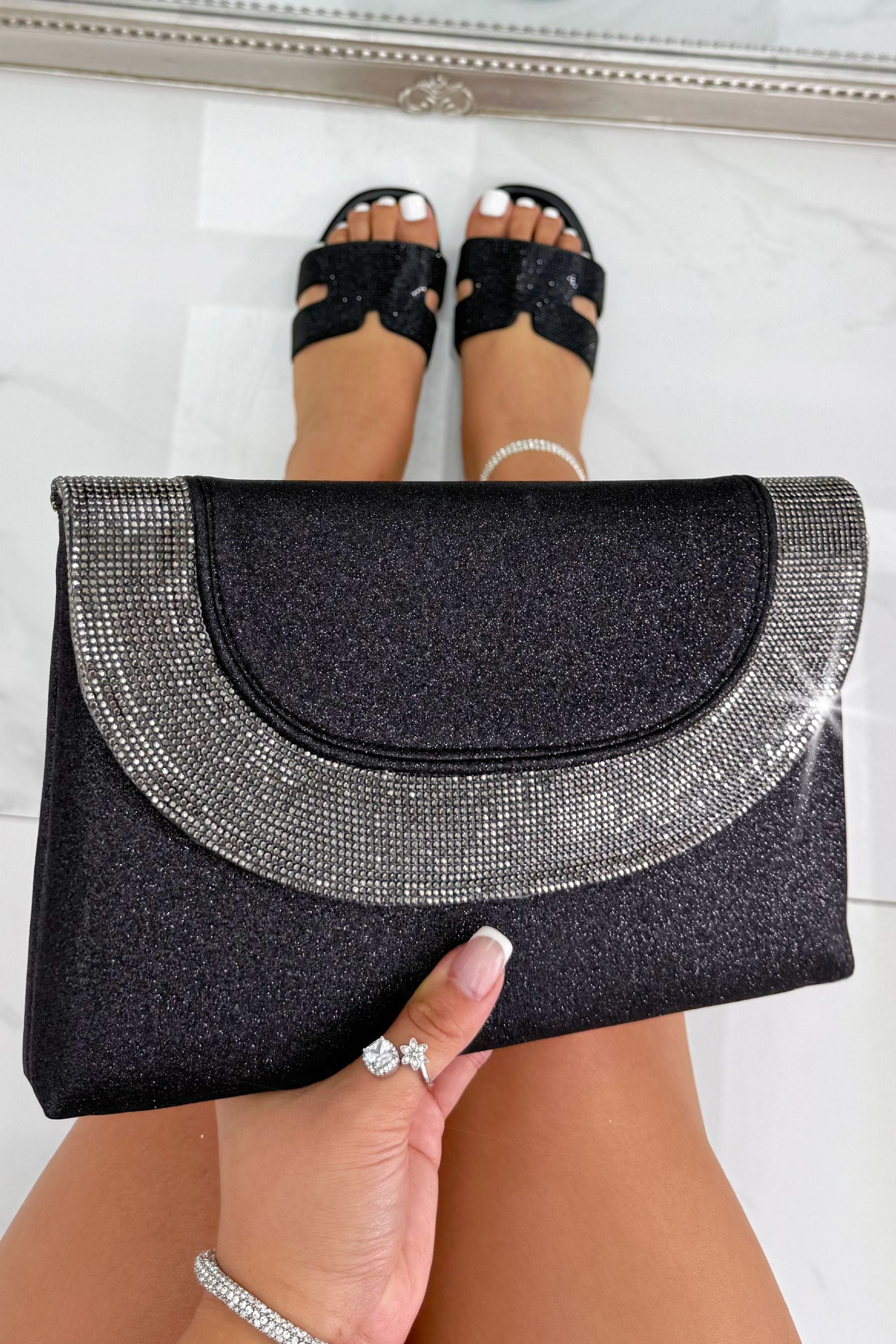 Glitter Luxe Metallic Crystal Envelope Clutch Bag Black featuring a glitter-finish exterior and elegant crystal detailing.