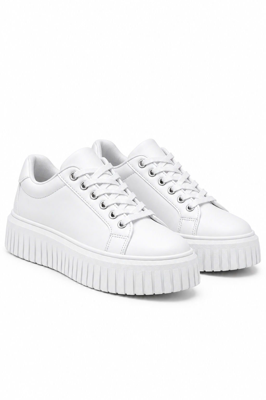 A pair of white low-top platform sneakers with white laces and thick, ribbed white soles, shown on a clean white background.