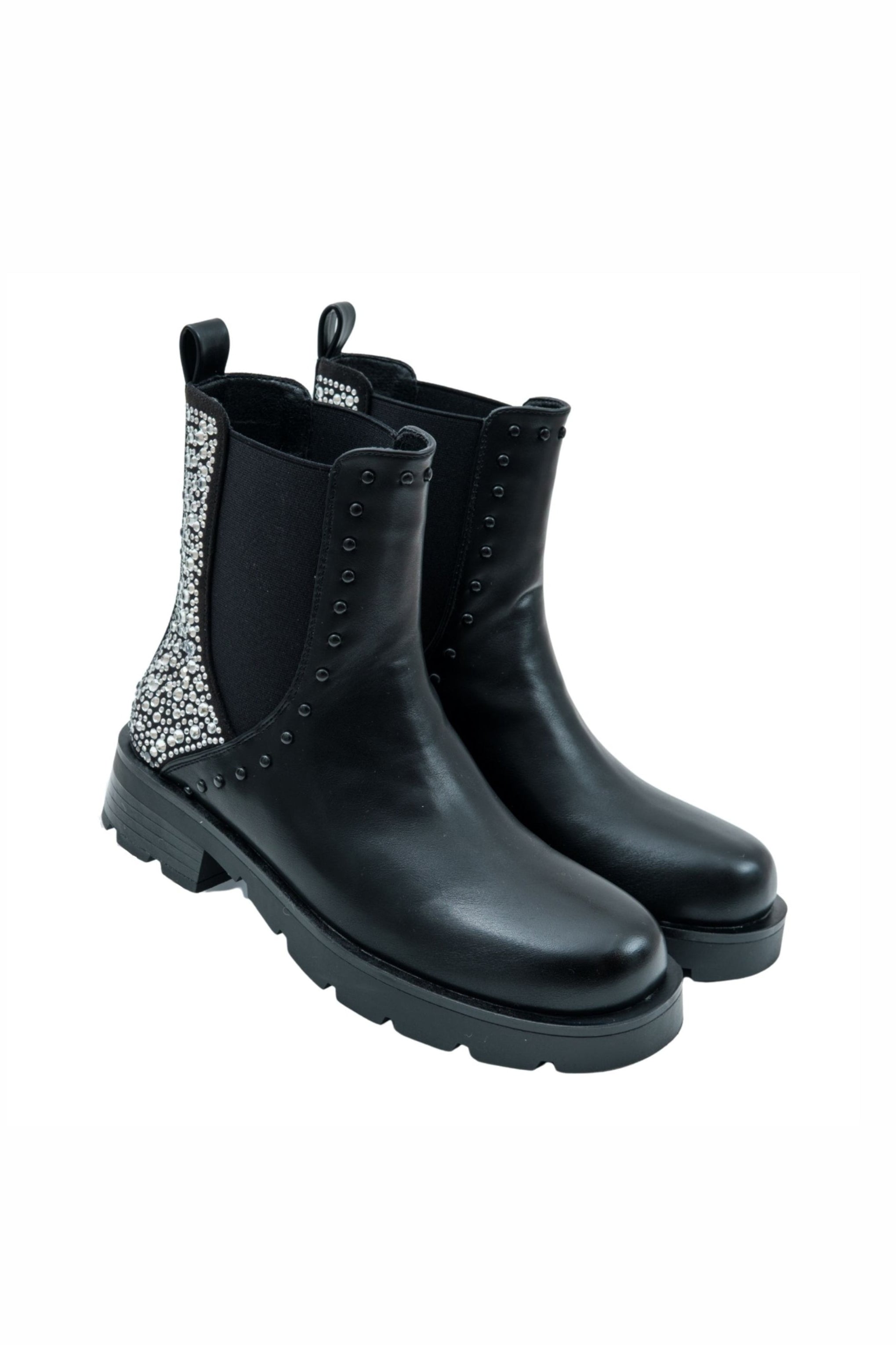 Black Chelsea boots with decorative elements on a white background