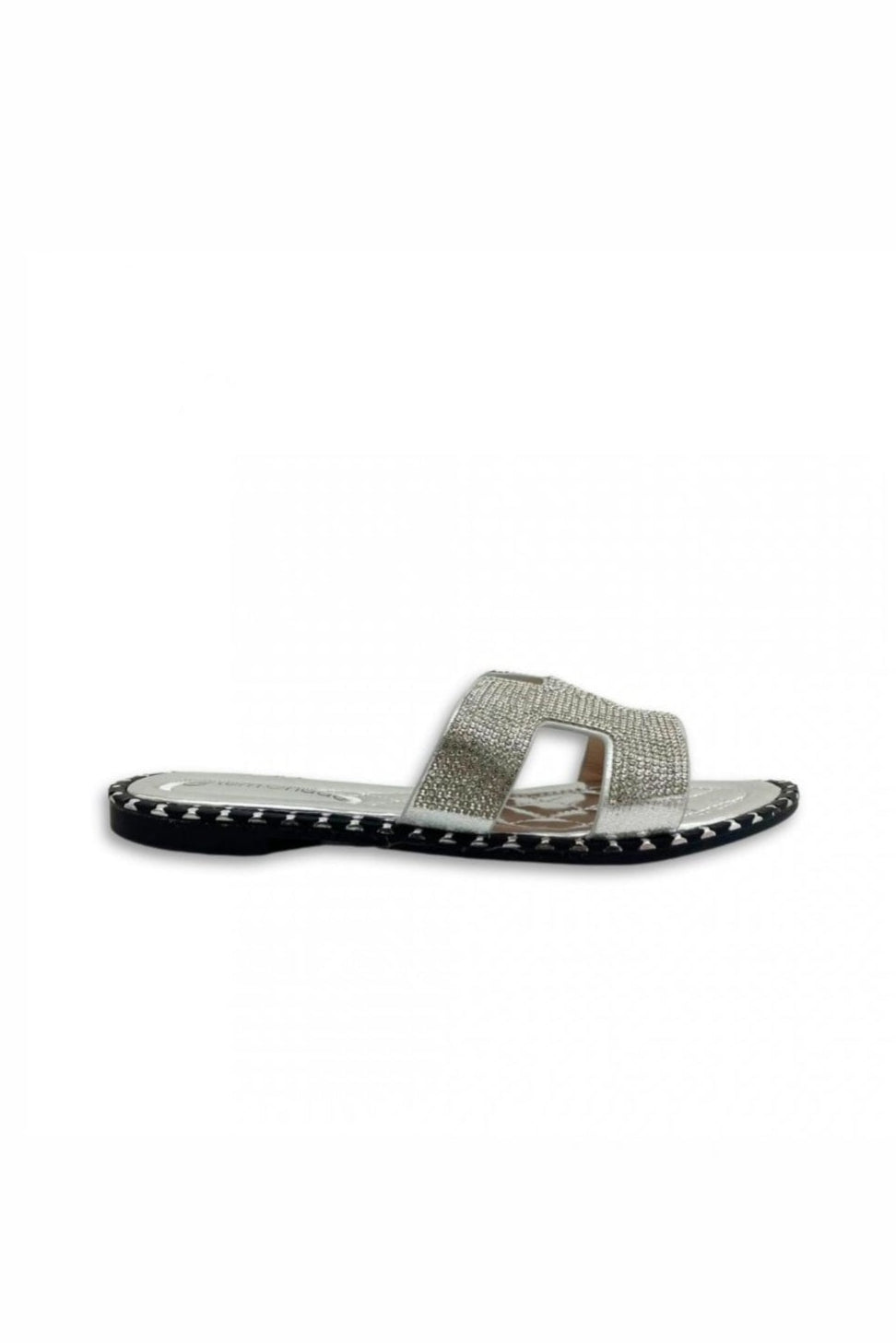 Silver sandal with studded details on a white background