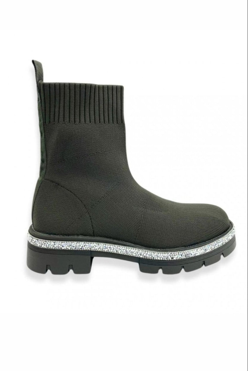 Khaki sock boot with glittery sole on a white background
