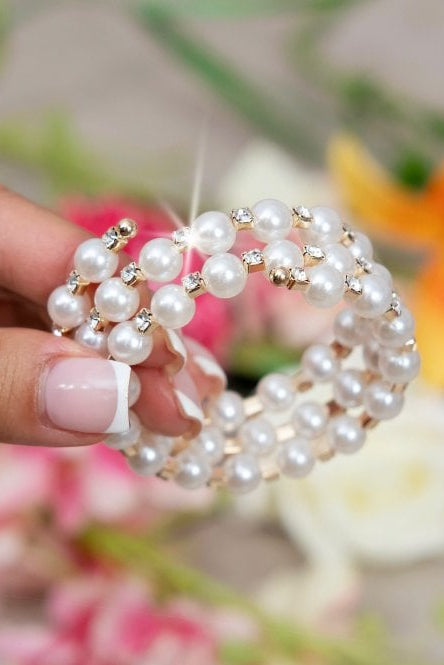 Crystal Enchanted Pearl Bangle Bracelet Gold with features 3 rows of lustrous pearls and sparkling rhinestone crystals