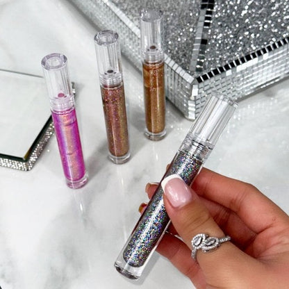 Sparkle Lip Gloss Set of 4, showcasing candy Pink - A hot pink shimmer that adds freshness and glow