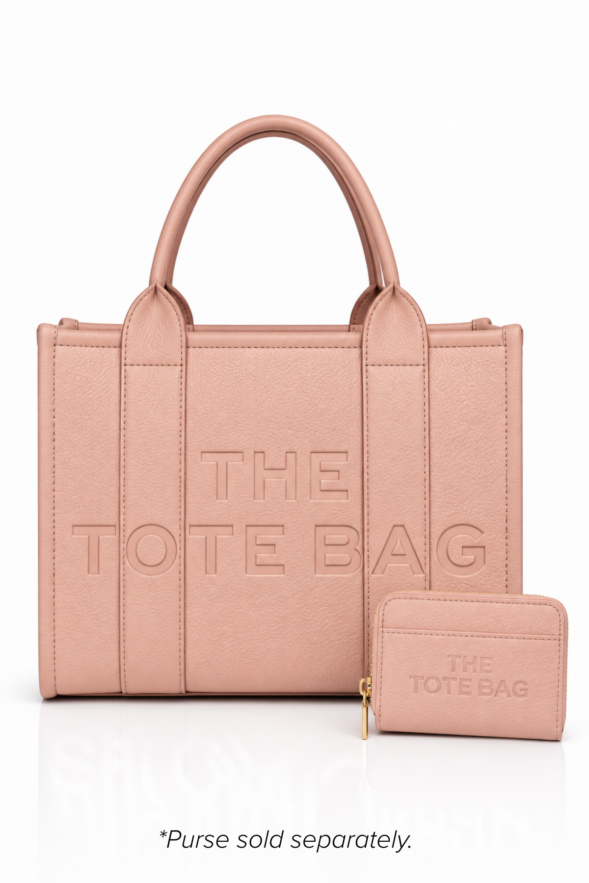 Metallic Pink faux leather structured tote bag with two rounded top handles, embossed. "THE TOTE BAG" lettering on the front, vertical stitched panels, contrast edging stud details. 