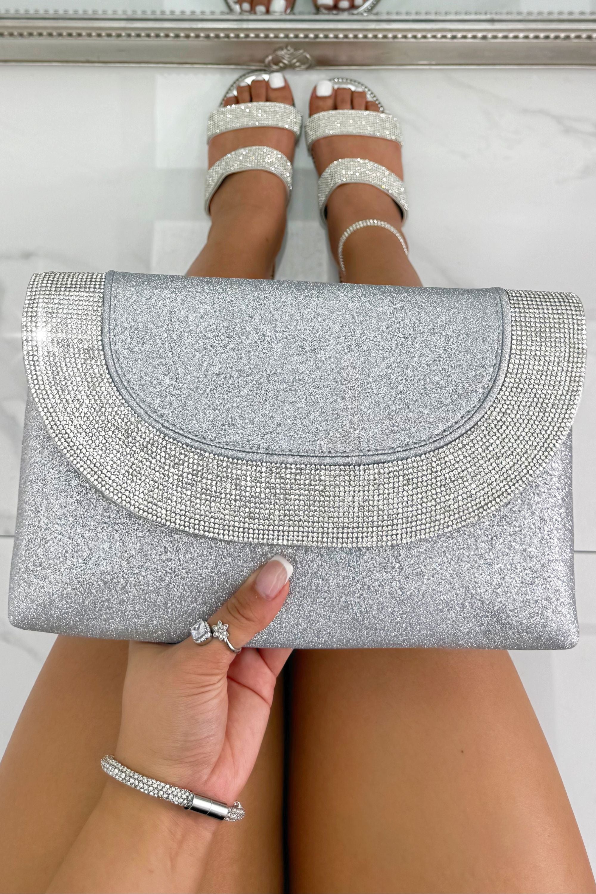Glitter Luxe Metallic Crystal Envelope Clutch Bag Silver featuring a glitter-finish exterior and elegant crystal detailing.
