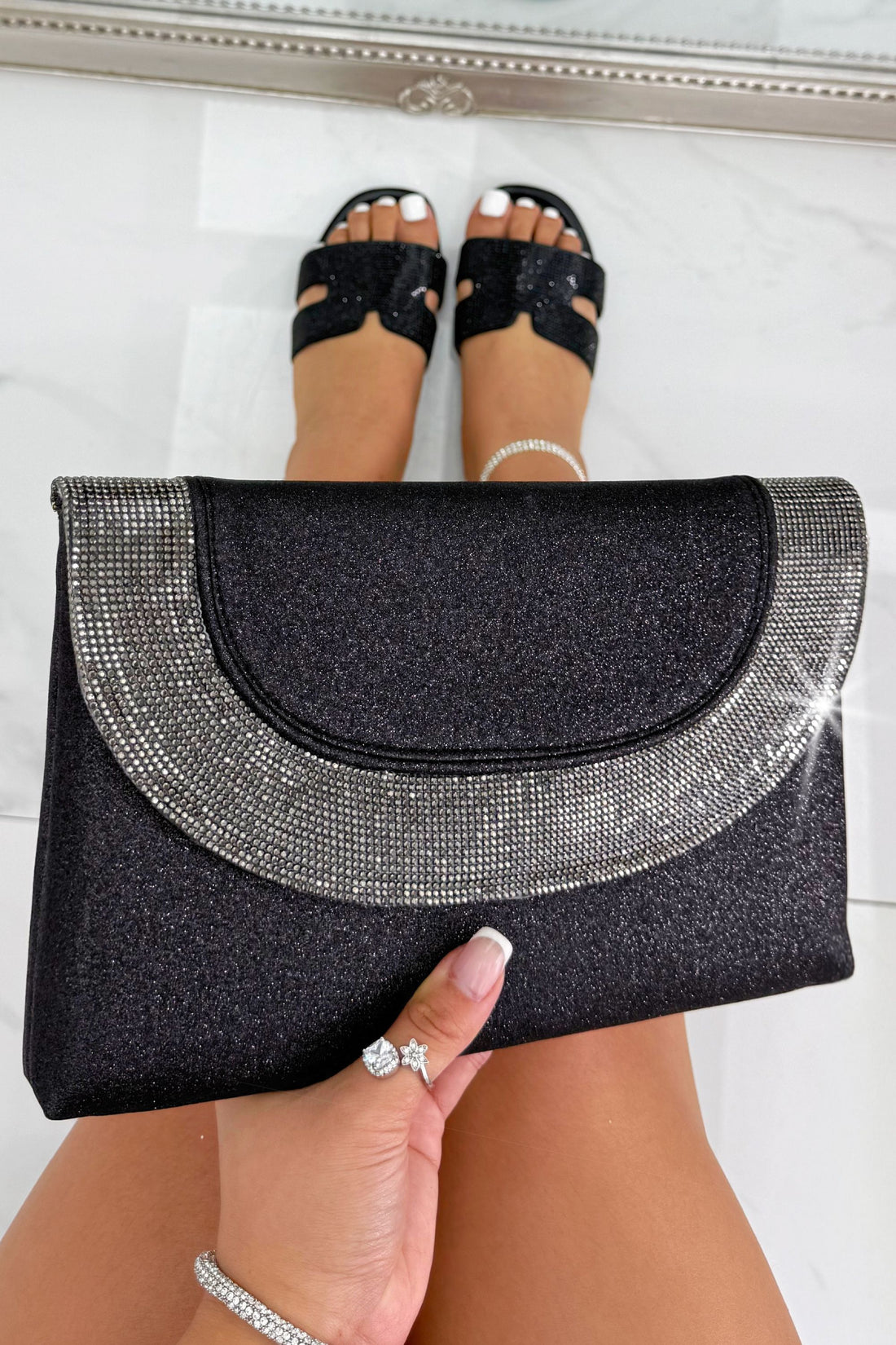 Glitter Luxe Metallic Crystal Envelope Clutch Bag Black featuring a glitter-finish exterior and elegant crystal detailing.