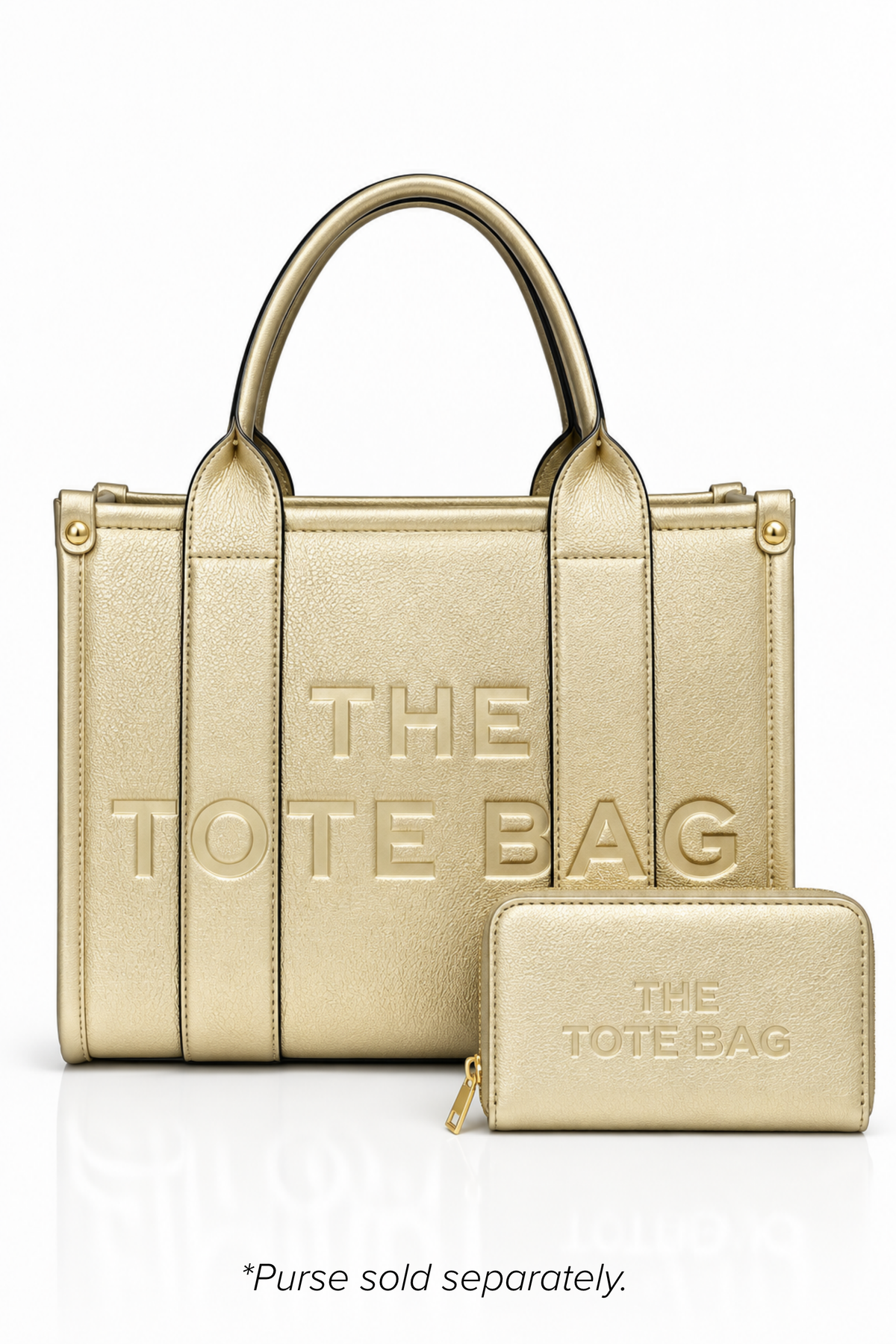 Metallic Gold structured tote bag with two rounded top handles, embossed. "THE TOTE BAG" lettering on the front, vertical stitched panels, contrast edging and gold- tone stud details.  Metallic gold Tote purse pictured in front. Set against a white background.