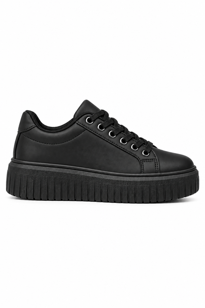 Black sneaker with black sole on a light gray background