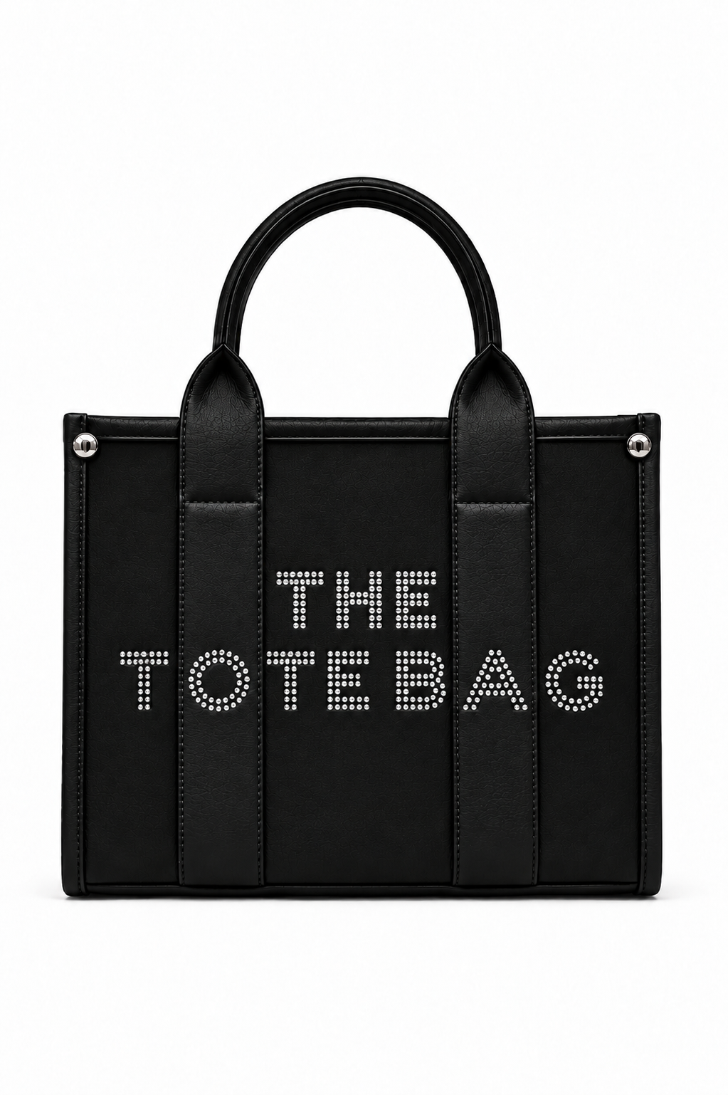 Black structured Tote handbag with two rounded top handles, vertical stitched pictures and silver-tone stud details at the upper corners. Features white studded "THE TOTE BAG" lettering across the front, a top zip.