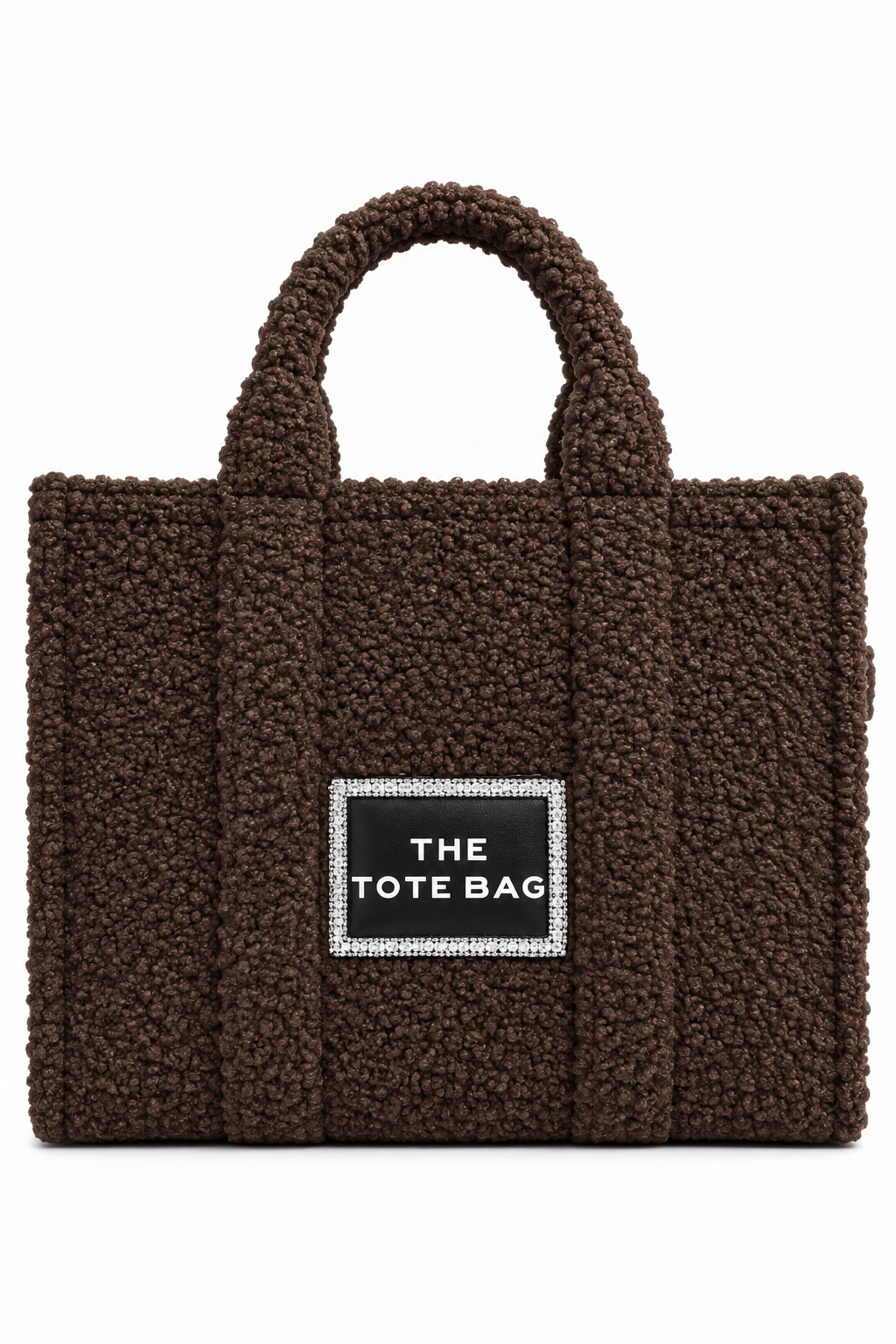 A dark brown bouclé tote bag with dual top handles and a black rectangular label on the front that reads &