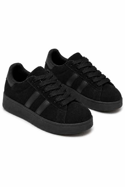 A pair of low-top black sneakers with black laces, black side stripes, and black soles, photographed on a clean white background.