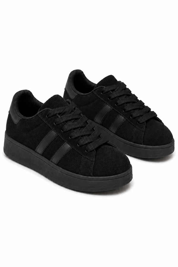 A pair of low-top black sneakers with black laces, black side stripes, and black soles, photographed on a clean white background.