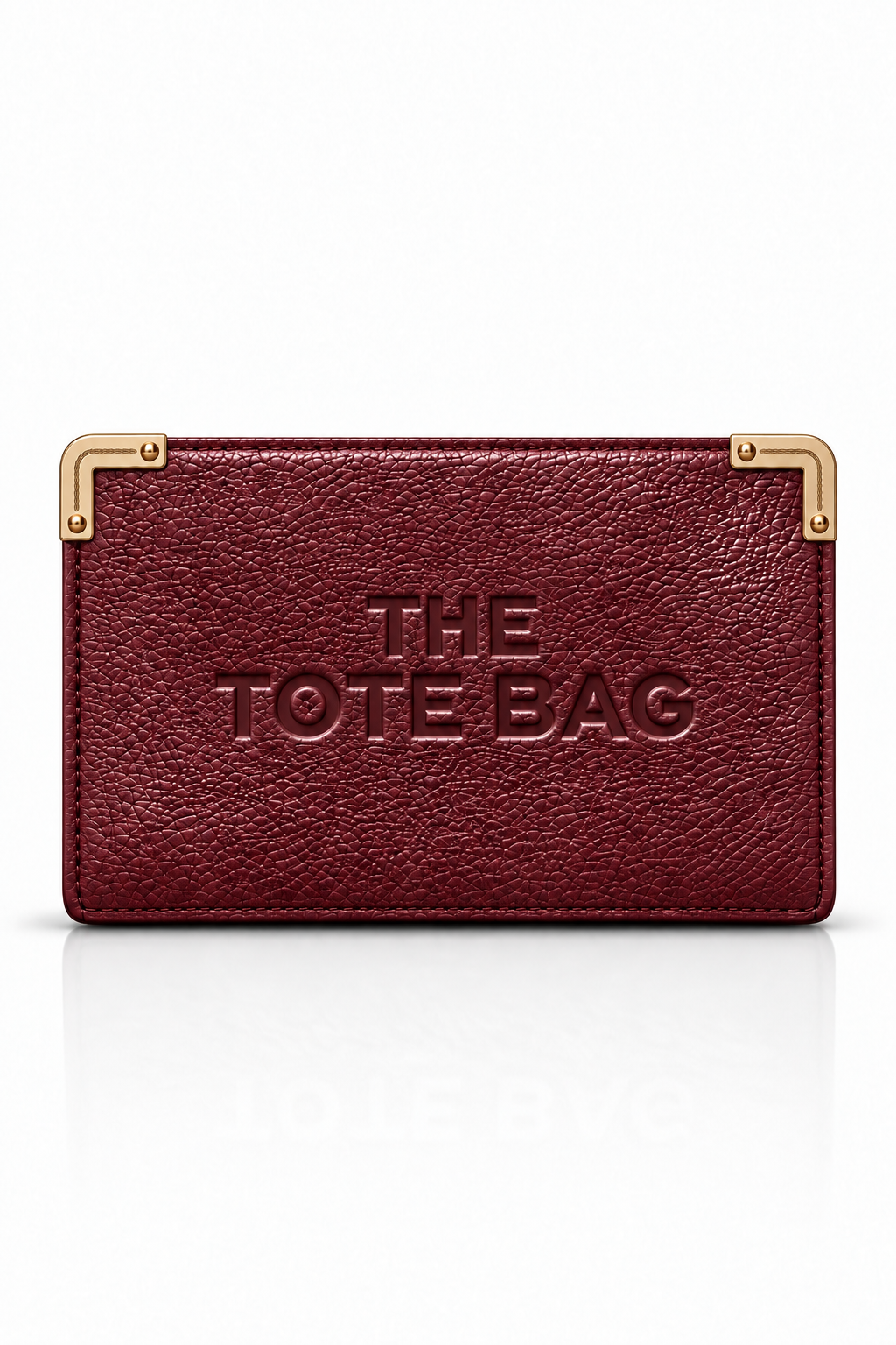 A burgundy textured leather tote bag with gold metal corner hardware and embossed &