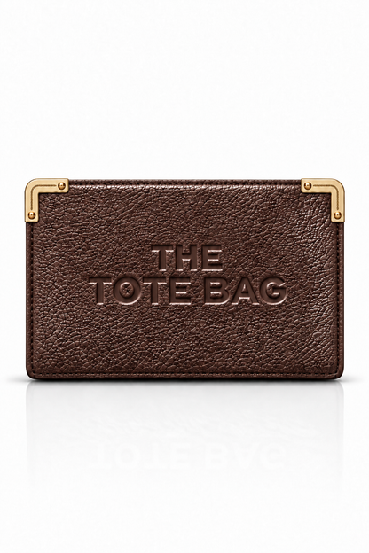A dark brown textured leather tote bag with gold-tone metal corner protectors and embossed &