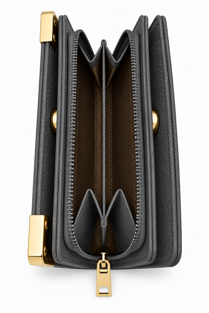 Charcoal grey textured tote purse shown form the side, featuring multiple accordion style compartments, a central zippered section with grey zip trim, and gold-tone zipper pull metal hardware. 