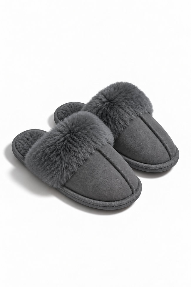 A pair of dark gray slip-on slippers with fluffy faux-fur trim on the top, shown on a clean white background.