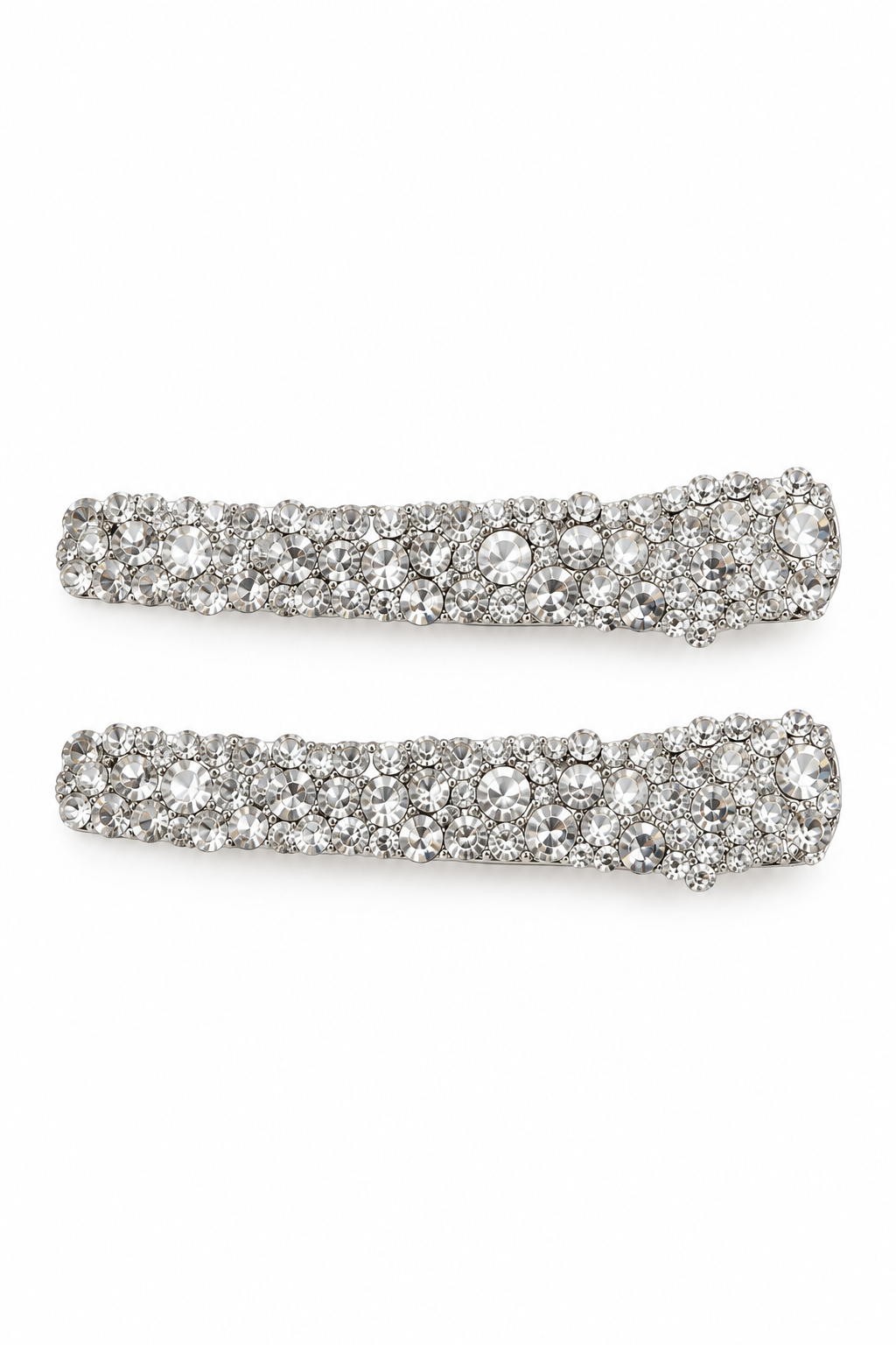 Two silver-toned barrette hair clips fully covered in clear rhinestones, displayed horizontally on a plain white background.