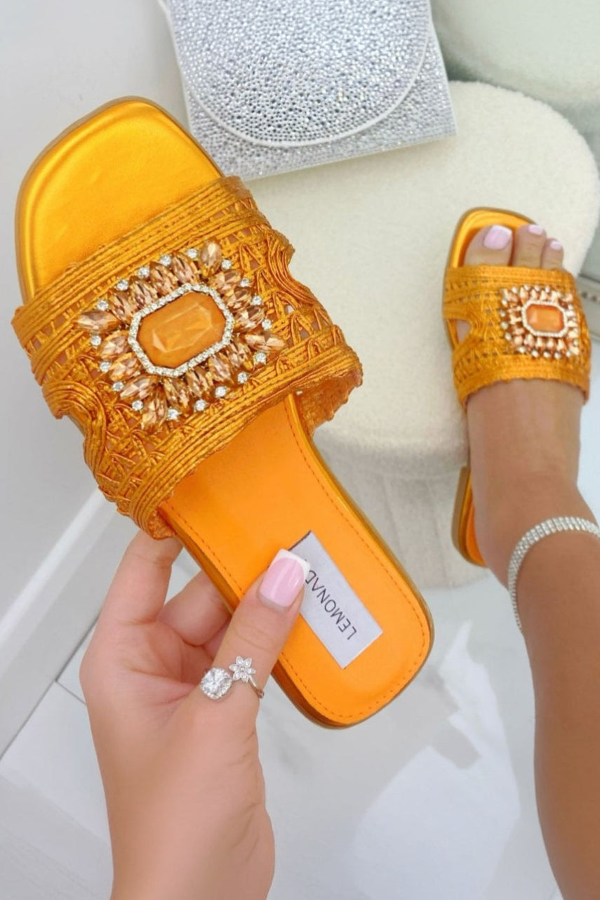 Orange sliders being held in hand