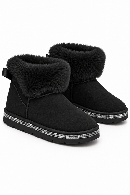 A pair of black suede ankle boots with plush black faux fur trim around the collar and a silver rhinestone-embellished band around the sole, shown on a white background.