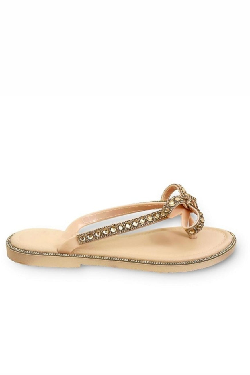 Rose gold sparkly sandals against a white background