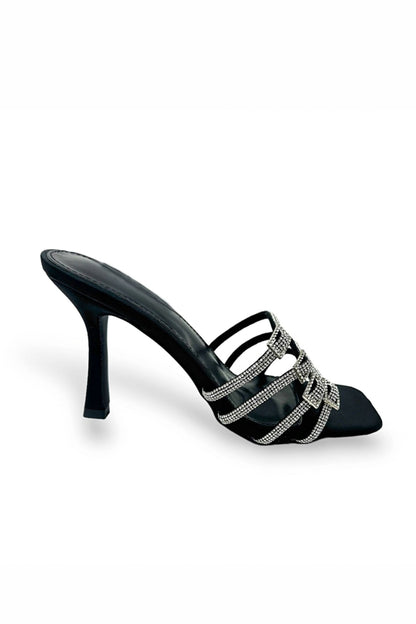 Black high-heeled sandal with silver straps on a white background