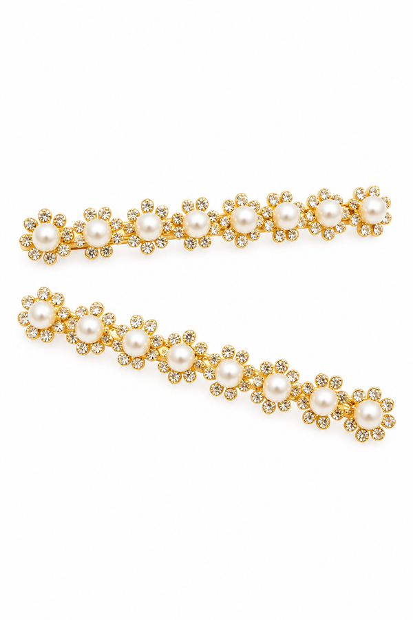 Two gold hair clips decorated with faux pearls and small clear rhinestones in a floral daisy pattern, displayed on a clean white background.