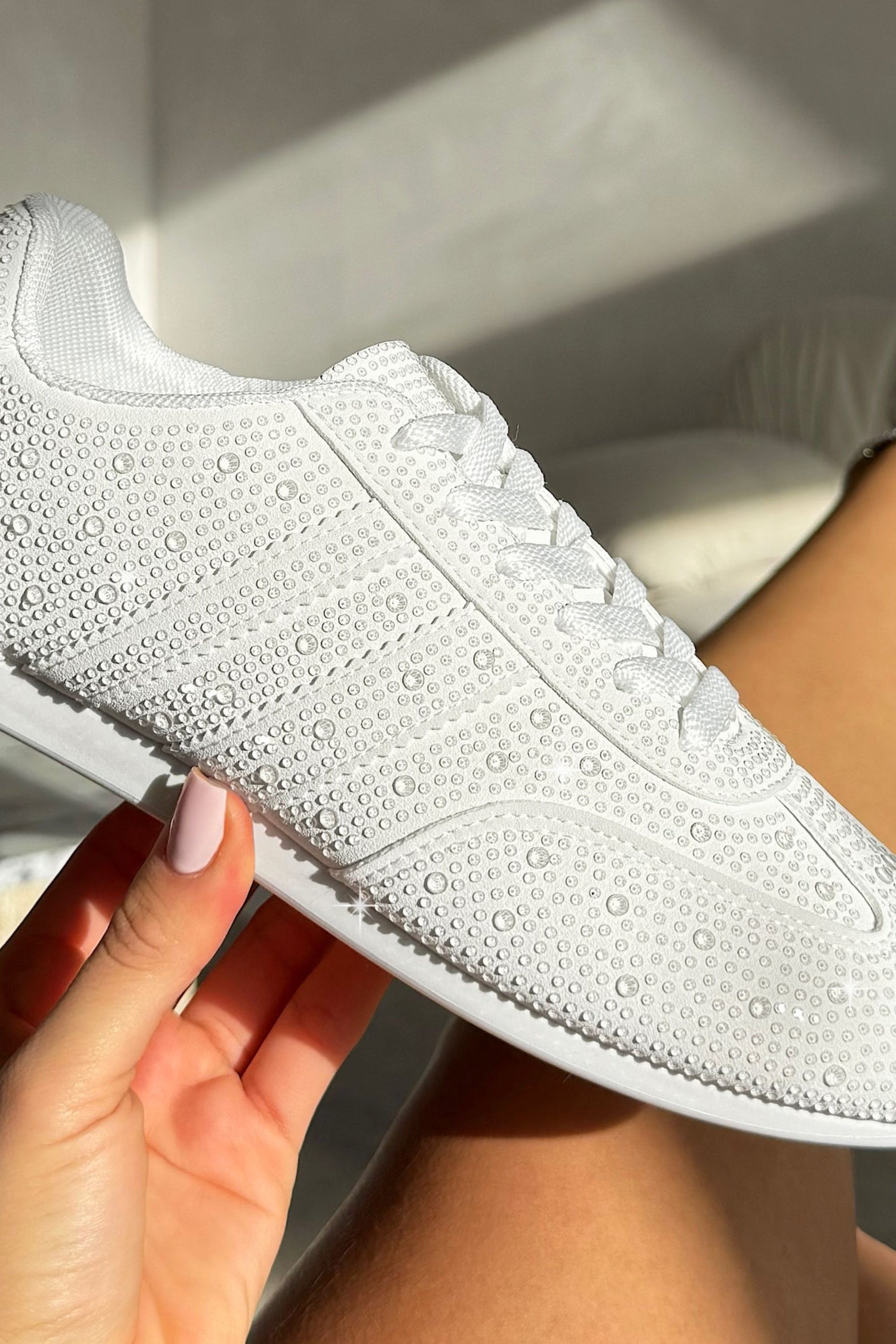 Crystal Dewdrop Lace-Up Trainers White, bringing attention to low-profile trainer silhouette