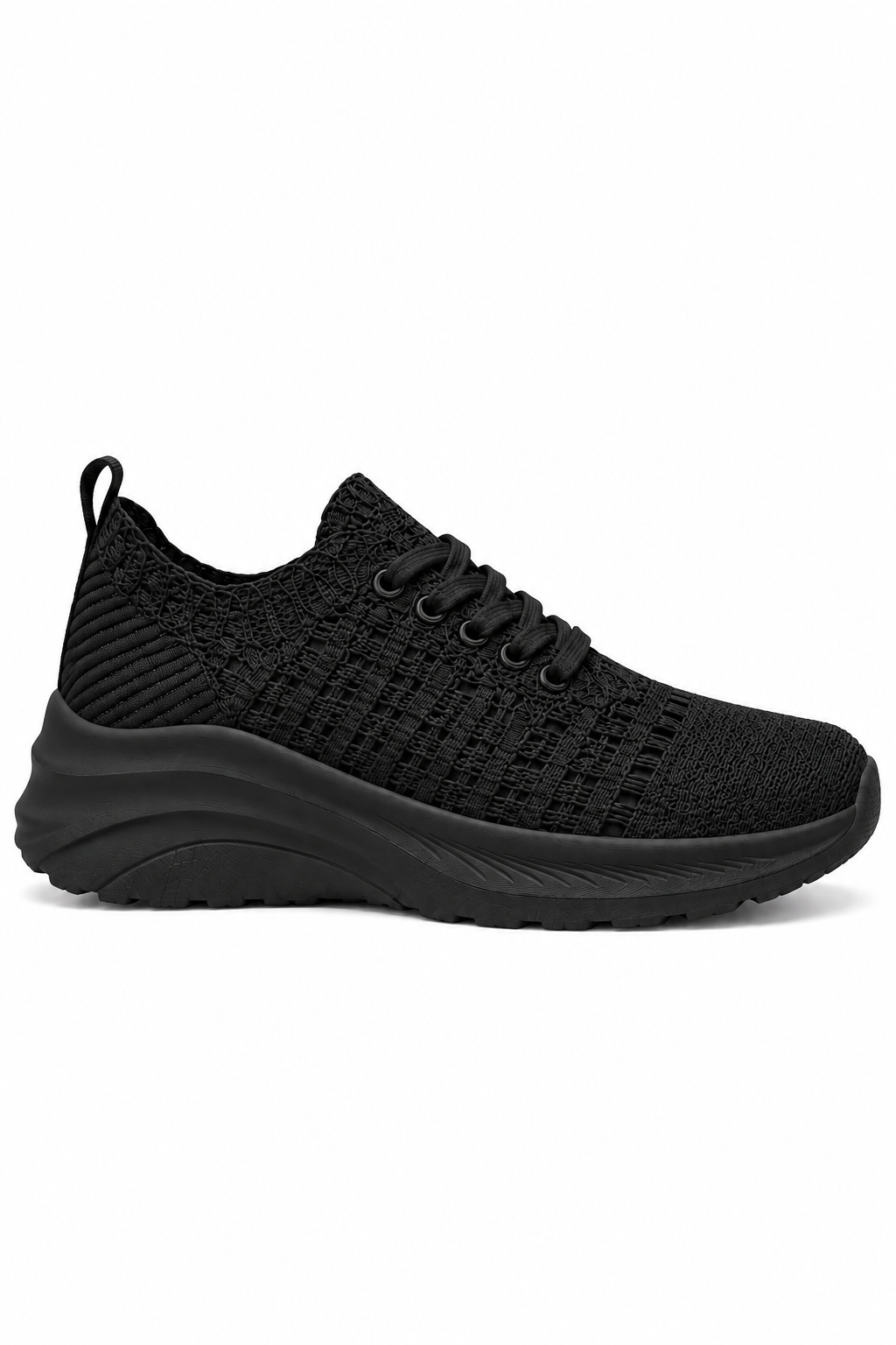 Black slip-on sneaker with black sole on a white background
