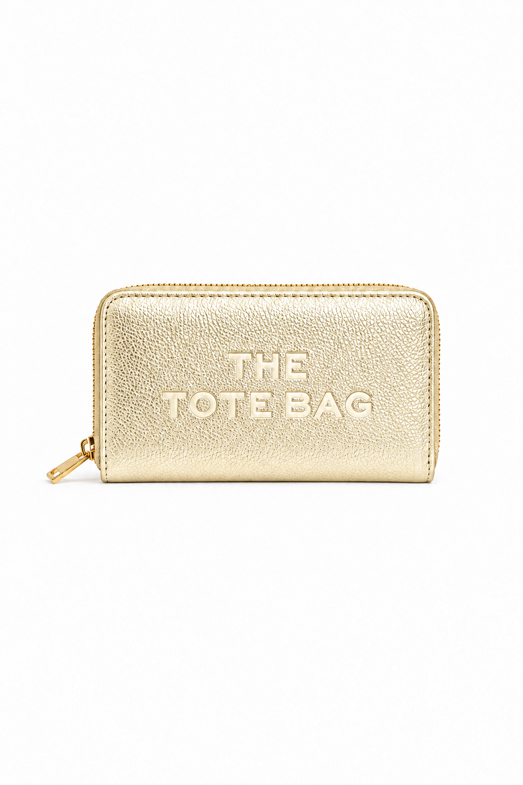 Metallic Gold rectangular zip-around purse with embossed "THE TOTE BAG" lettering on the front, contrast stitching around the edges and a gold-tone zip fastening with a matching pull tab. Set against a plain white background.