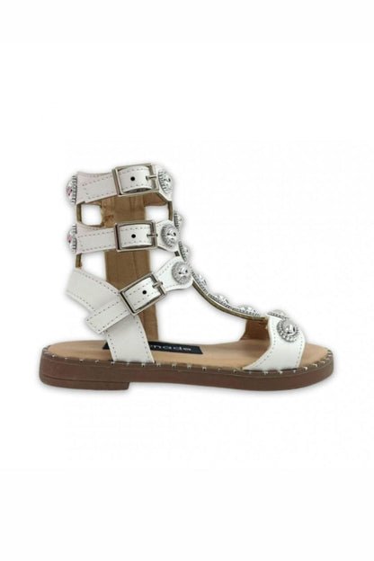 White Greek-inspired sandal on a white background