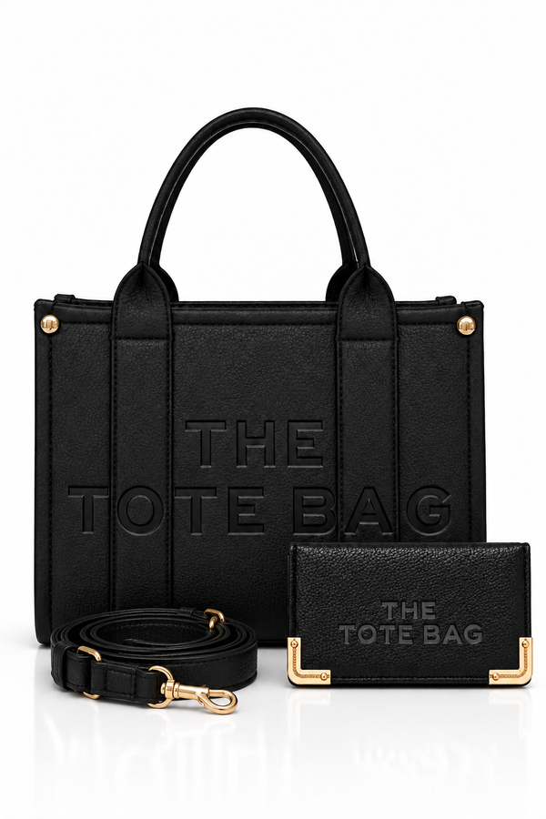 Black faux leather tote bag bundle featuring a matching adjustable shoulder strap with gold-tone hardware and a black mini purse with embossed “THE TOTE BAG” branding.