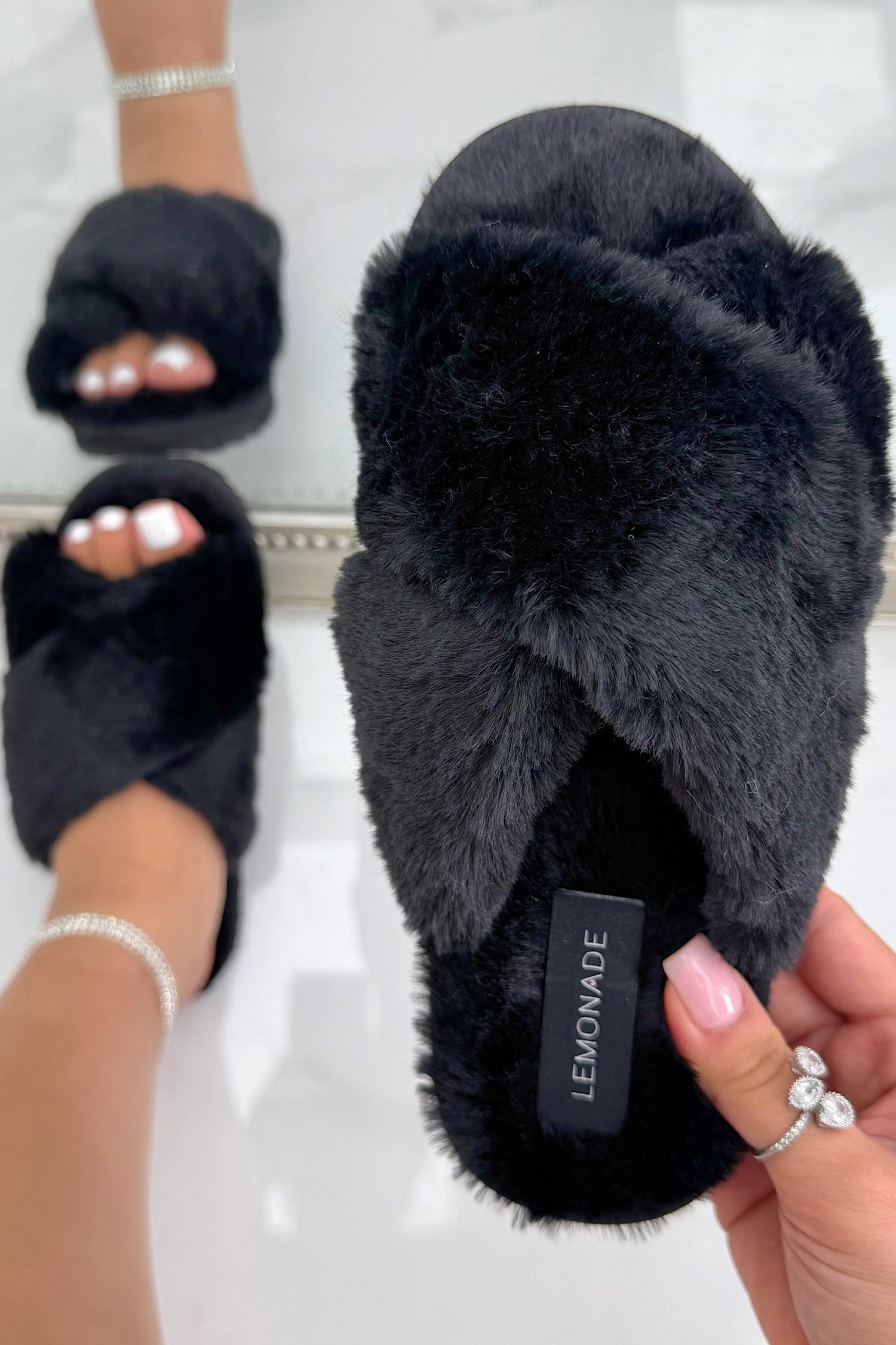 Midnight Luxe Crossband Faux Fur Slippers Black, showcasing open-toe slip-on design for easy wear