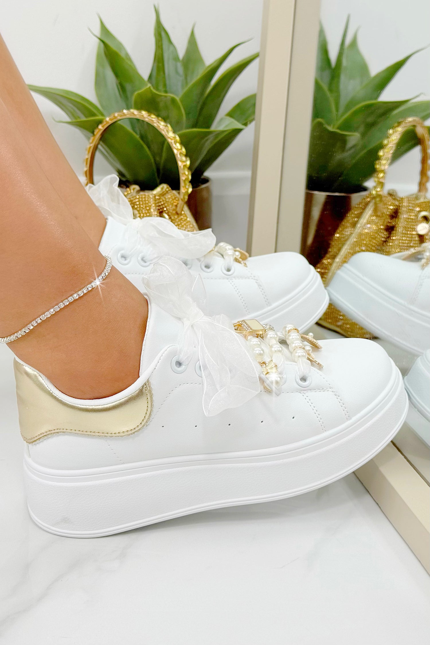 Sparkly Pearl Charm Trainers Gold, drawing attention to faux pearls, rhinestones &amp; metallic charm accents (padlock, bow, handbag)
