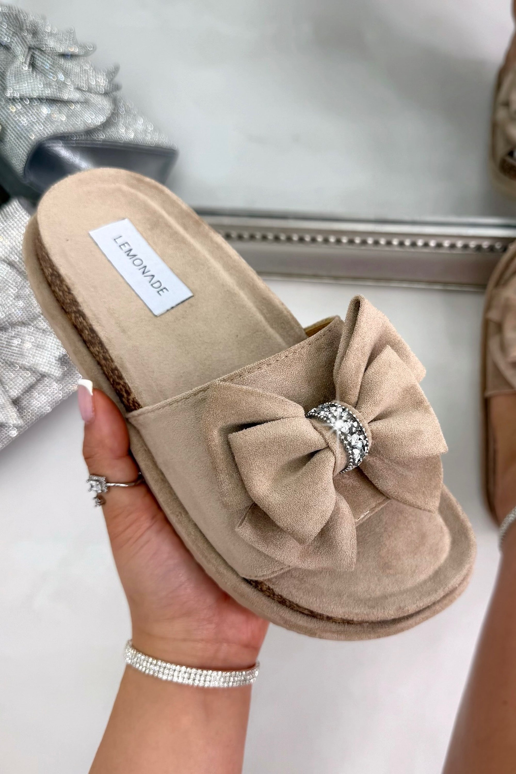 Sparkly Velvet Bow Platform Sliders Beige, drawing attention to easy slip-on slider design for effortless everyday wear