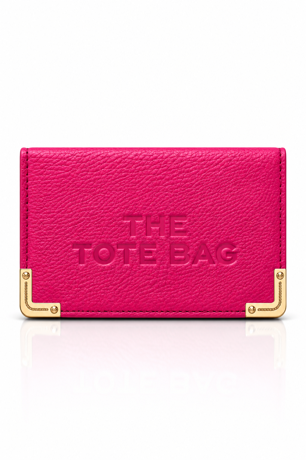 Hot Pink textured tote bag purse with embossed "THE TOTE BAG" lettering on the front, featuring gold tone metal corner protectors with decorative stud detailing.