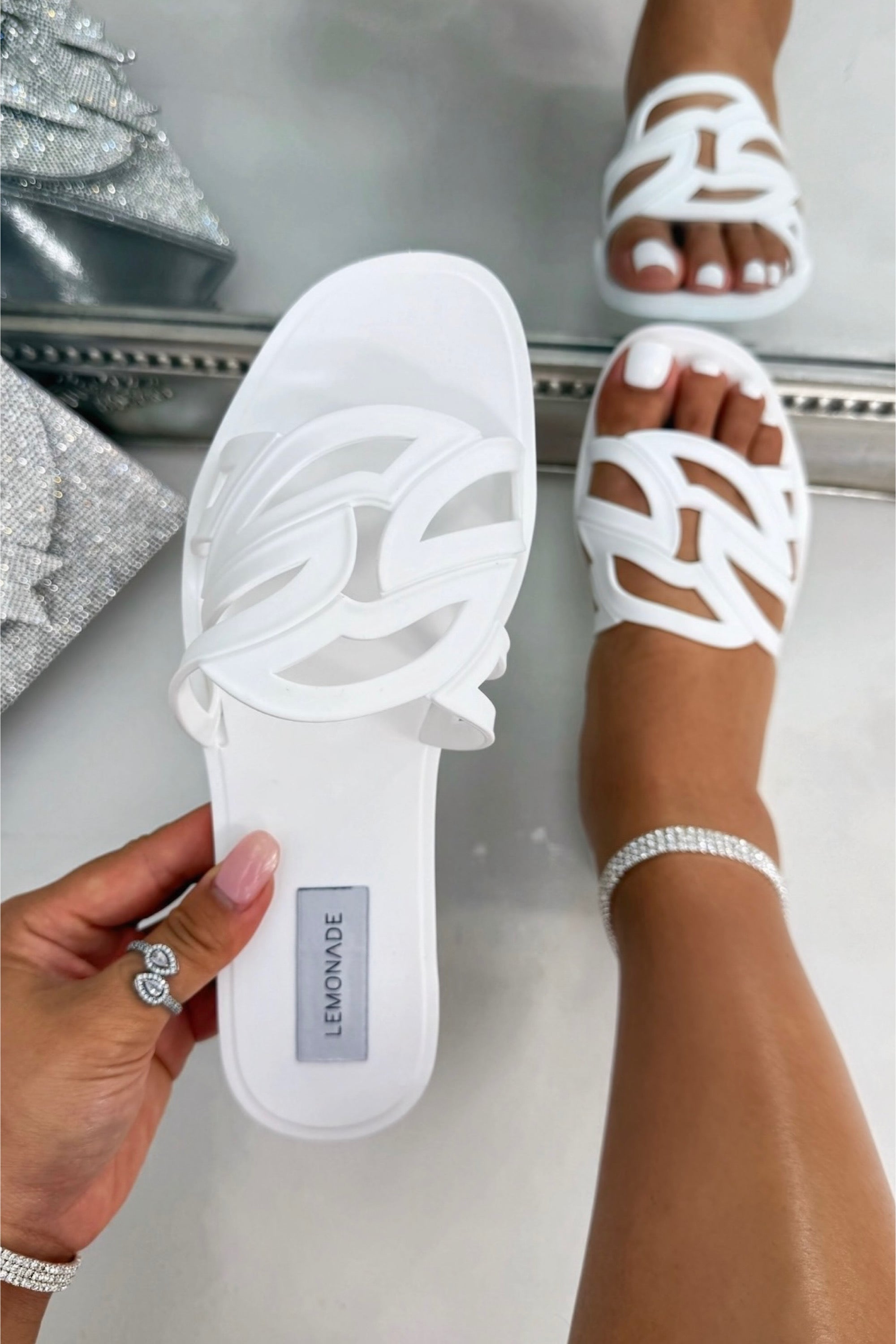 White sandals with &