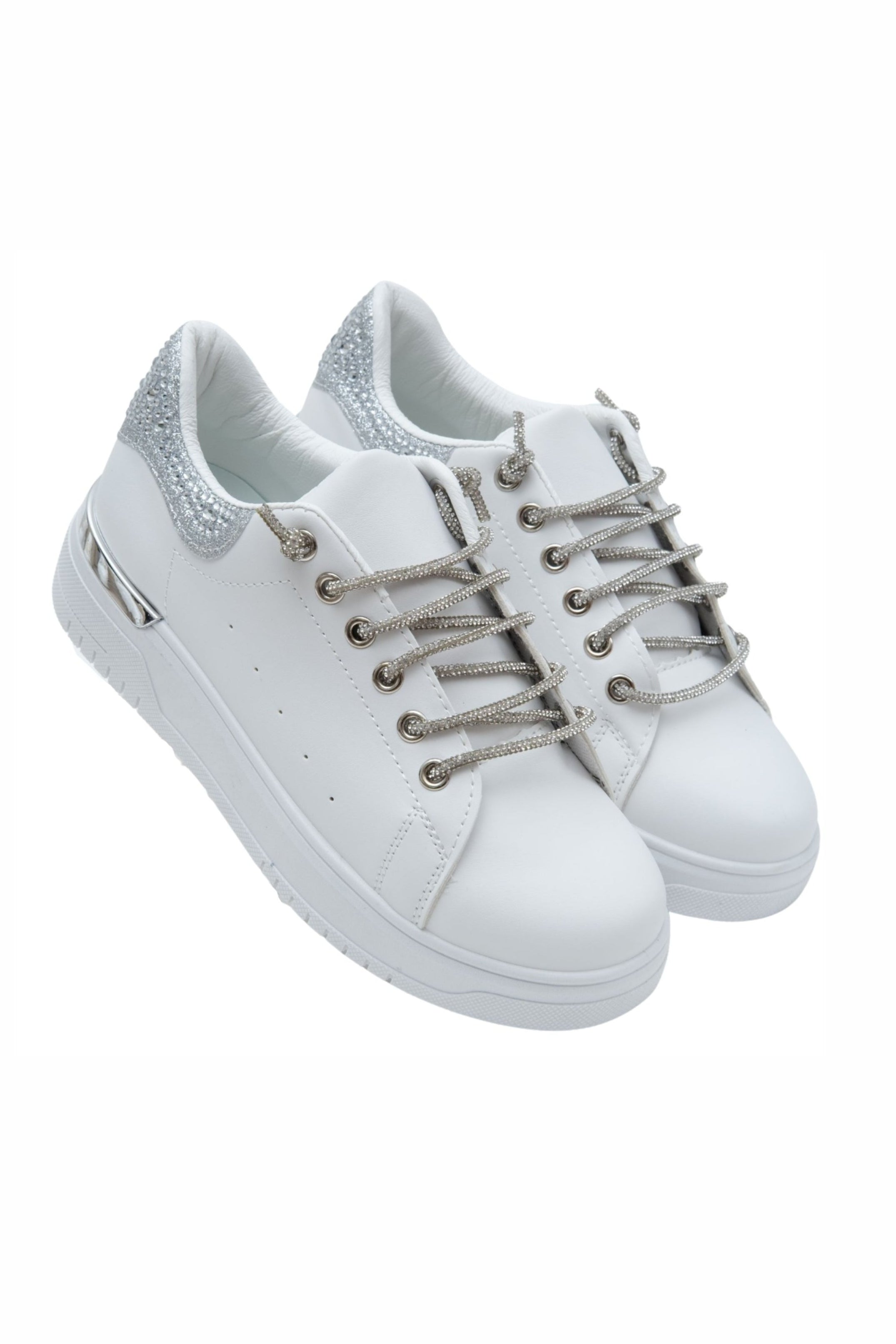 White sneakers with silver laces on a white background