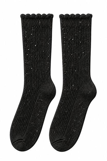 A pair of black ribbed crew socks with a subtle glittery texture and scalloped cuffs, displayed against a plain white background.