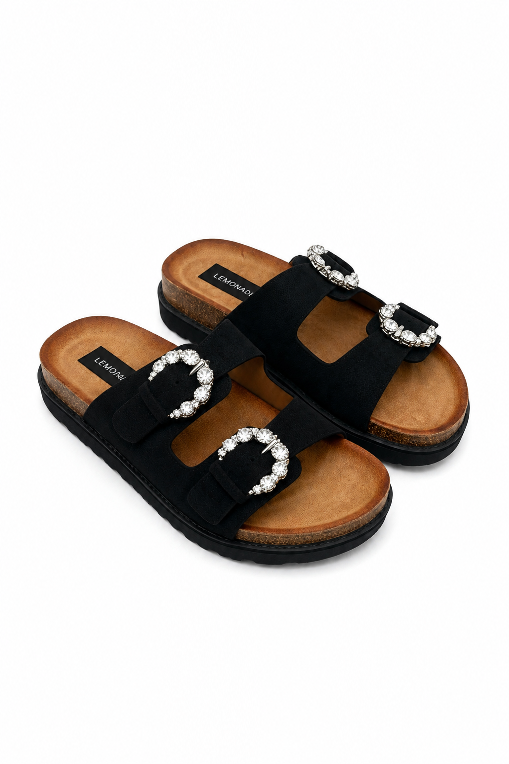 A pair of black double-strap slide sandals with silver-tone buckle embellishments set with clear rhinestones, shown on a plain white background.