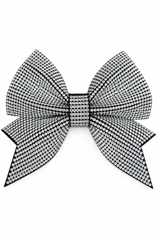 A large bow embellished with dense black and silver rhinestones, set against a plain white background.