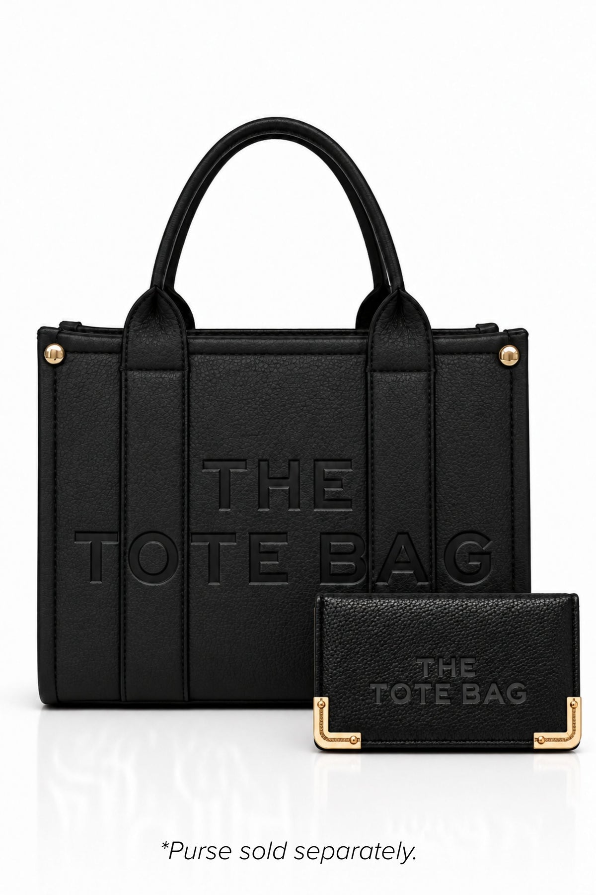 Black faux leather tote bag with two rounded top handles, embossed "THE TOTE BAG" lettering on the front, contrast stitching. gold tone hardware and a detachable adjustable black shoulder strap. With a TOTE purse pictured in front of bag.