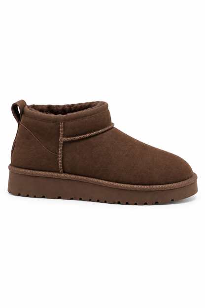 A single brown suede ankle boot with a thick brown sole, shown in a side profile on a plain white background.