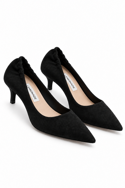 A pair of black pointed-toe kitten heel pumps with a soft suede-like finish, shown on a clean white background. The brand name &