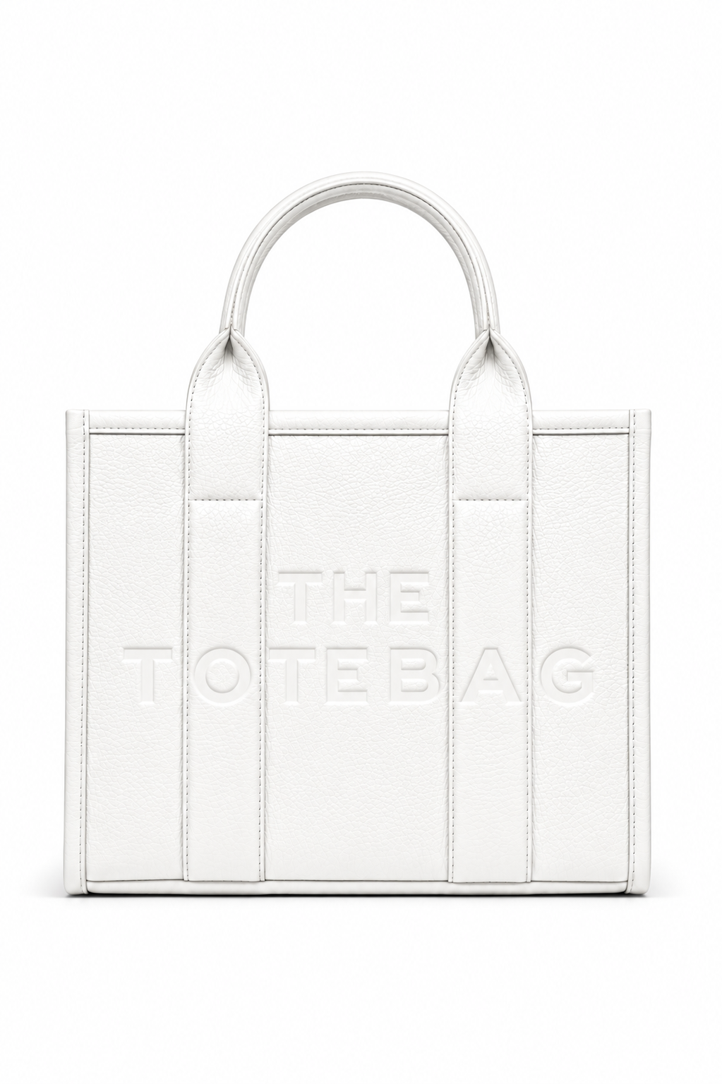 Medium white faux leather structured tote bag with two rounded top handles, embossed. "THE TOTE BAG" lettering on the front, vertical stitched panels. Pictured on a white background. 