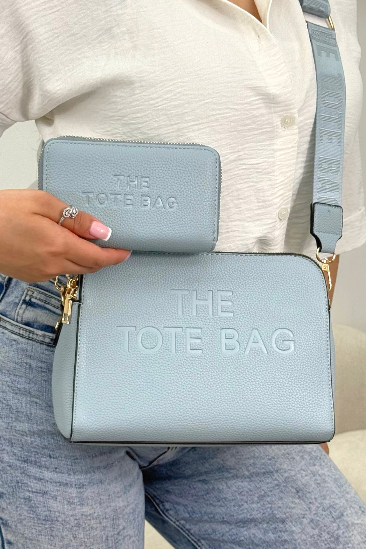 Faux Leather Triple Compartment Everyday Crossbody Tote Bag &amp; Faux Leather Everyday Wallet Tote Purse Blue Bundle featuring structured silhouette with modern embossed slogan detail